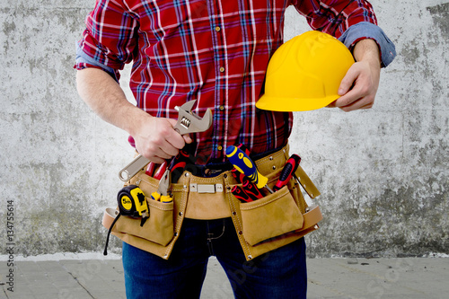 constructor with helmet and tools