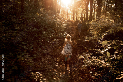 Two children walking outdoors