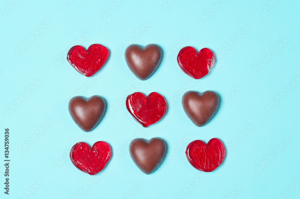 Chocolate candies and red lollipops.The form of hearts. Love concept. Valentine day.