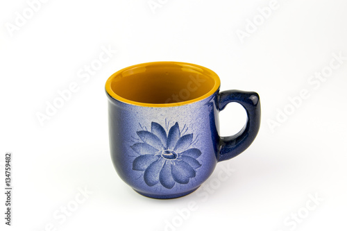 Beautiful blue cup with a pattern on a white background.