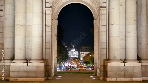 madrid city center at night traffic on calle de alcala seen through puerta de alcala