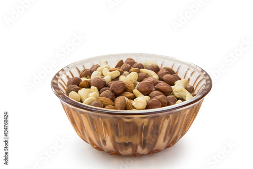 Fototapeta Naklejka Na Ścianę i Meble -  almonds, hazelnuts, cashews nuts in the plate