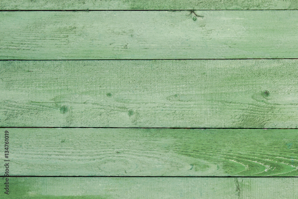 Naklejka premium Natural weathered wooden planks background. Old painted in green