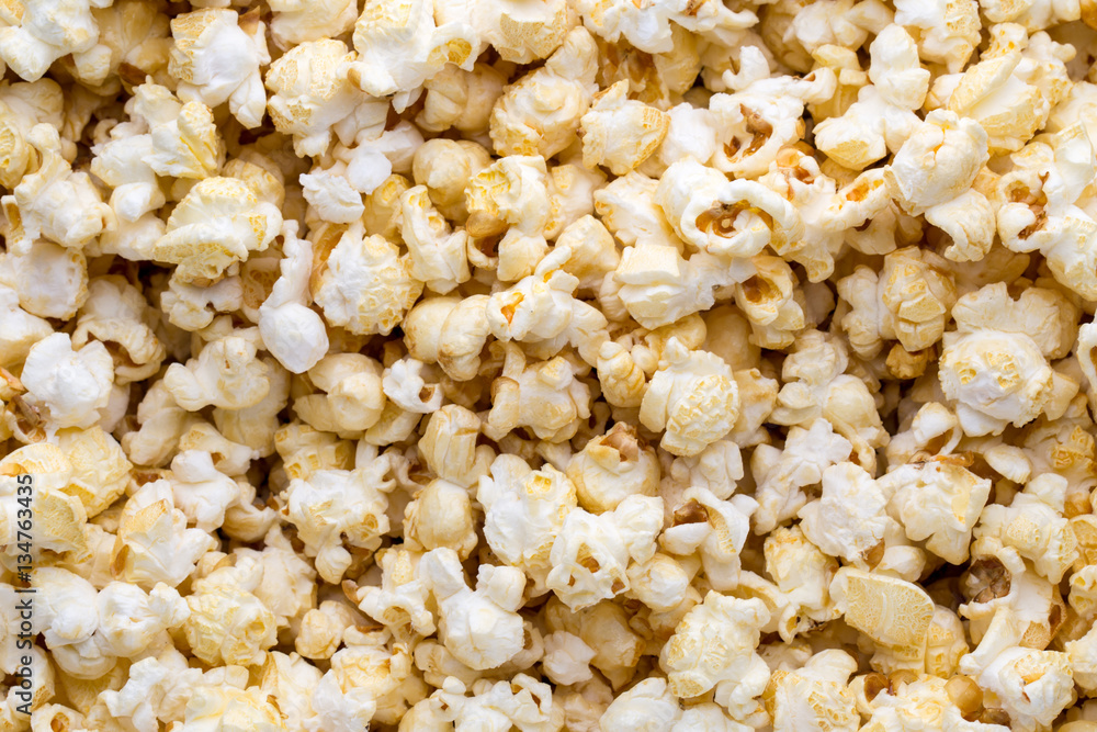 Popcorn background. Caramel sweet corn. Cinema snack.