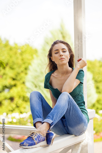 Free Download Young beautiful brown haired woman in blue jeans - GFXLoad