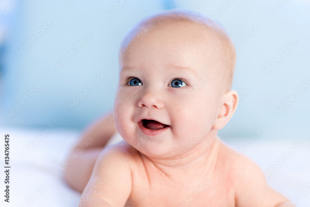 Baby in diaper in bed. Newborn at home. Baby in diaper in bed. Newborn at home.