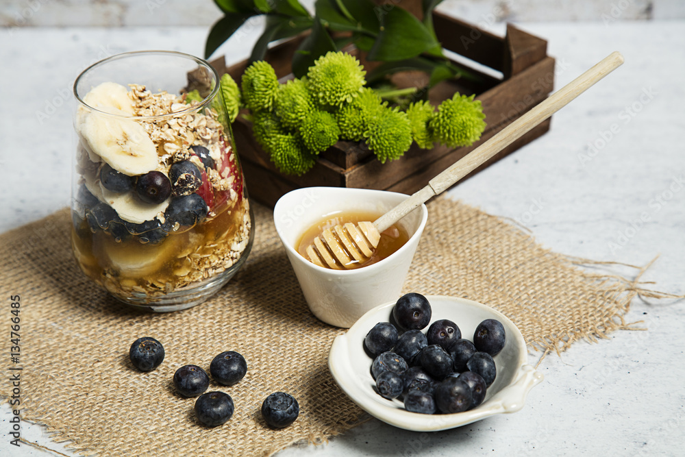 Granola served with yogurt, fruits and honey Granola served with yogurt, fruits and honey