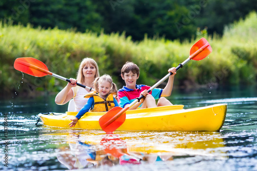 Family enjoying kayak ride on a river