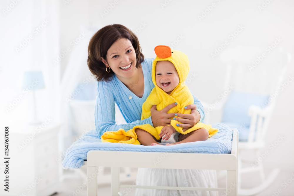 Mother and baby in towel after bath