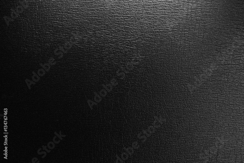 Black background with spotlight. black leather texture background surface.