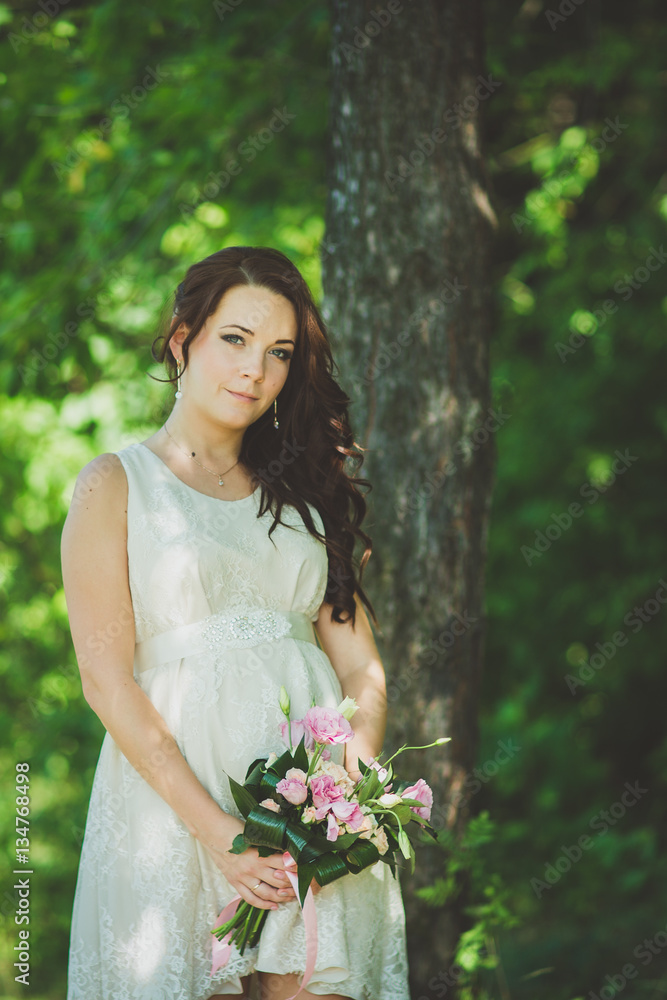 Fashion gorgeous young blonde woman in beautiful white dress in a fairy-tale forest. magic atmosphere Fashion gorgeous young blonde woman in beautiful white dress in a fairy-tale forest. magic atmosphere