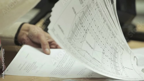 Business woman at the table familiarize with the text and diagrams contract business project.