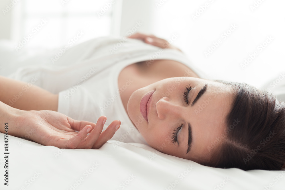 Beautiful woman sleeping in bed