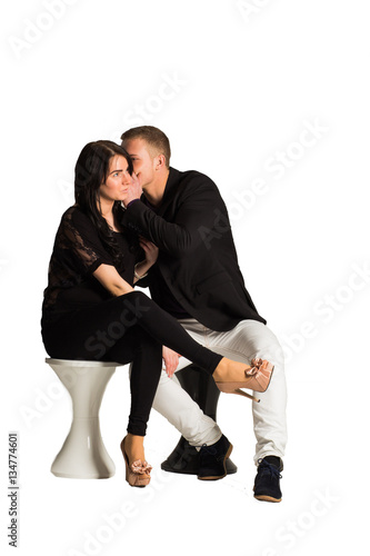 Attractive man whispering and flirting with girlfriend.isolated