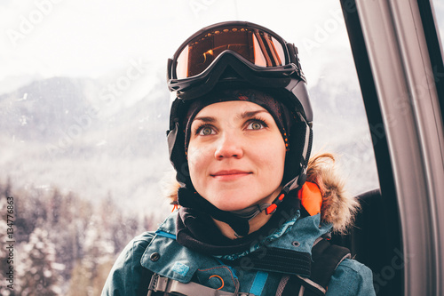 Happy girl on ski resort.