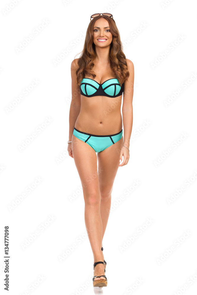 Fashion Model In Swimsuit Walking Towards Camera Fashion Model In Swimsuit Walking Towards Camera