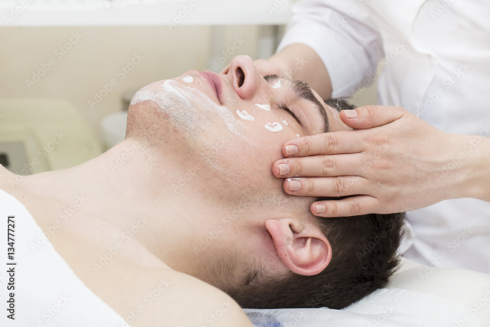 Man in the mask cosmetic procedure in spa salon Man in the mask cosmetic procedure in spa salon
