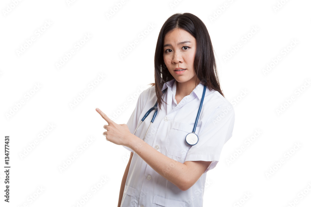 Asian young female doctor point to blank space. Asian young female doctor point to blank space.