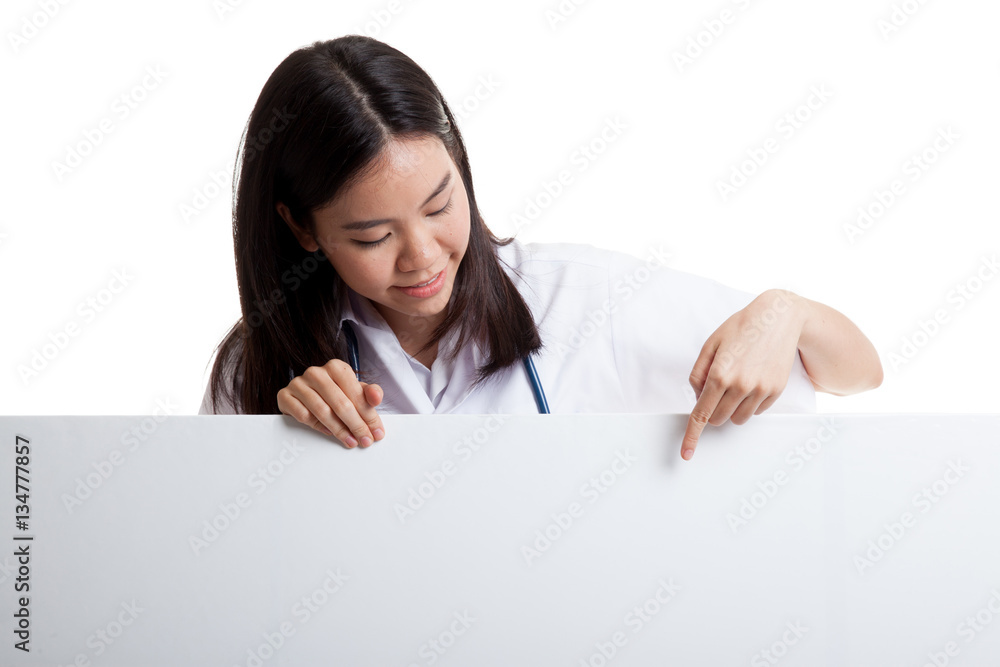 Young Asian female doctor point and look down to blank sign. Young Asian female doctor point and look down to blank sign.
