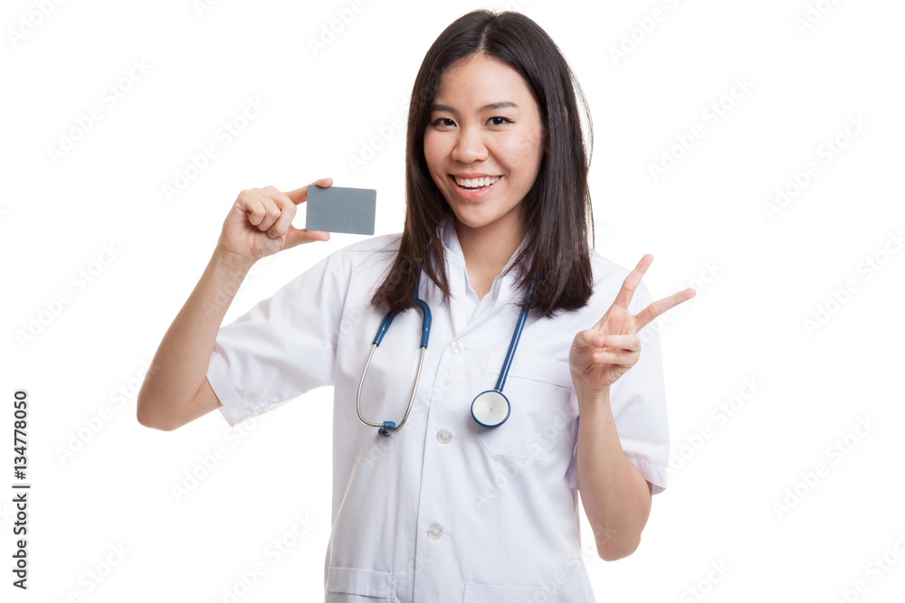 Asian young female doctor show victory sign with blank card. Asian young female doctor show victory sign with blank card.