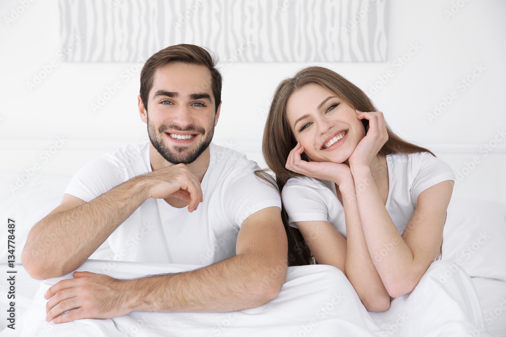 Young cute couple together in bed Young cute couple together in bed