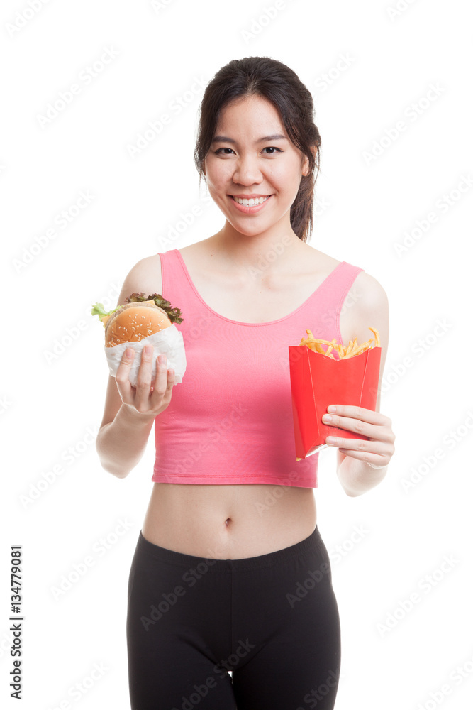 Beautiful Asian healthy girl with french fries and hamburger. Beautiful Asian healthy girl with french fries and hamburger.