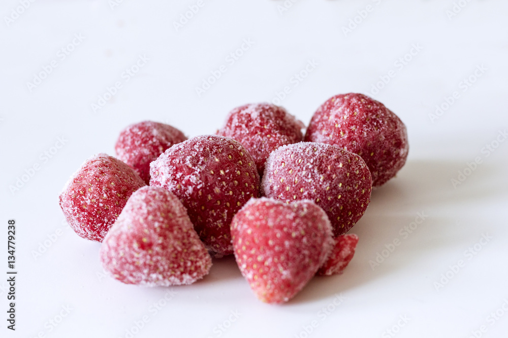 Frozen strawberries on white background. Close up Frozen strawberries on white background. Close up