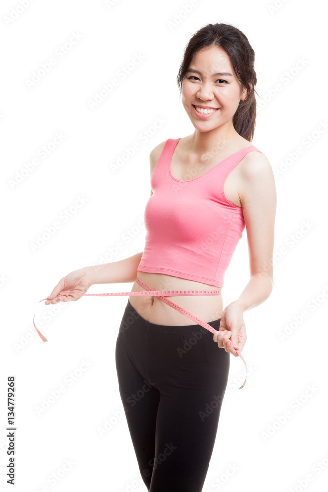Beautiful Asian healthy girl measuring her waist. Beautiful Asian healthy girl measuring her waist.