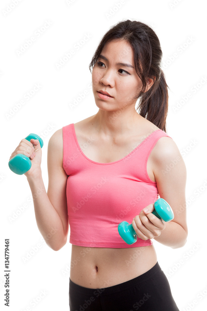 Tired Asian healthy girl exercise with dumbbell. Tired Asian healthy girl exercise with dumbbell.