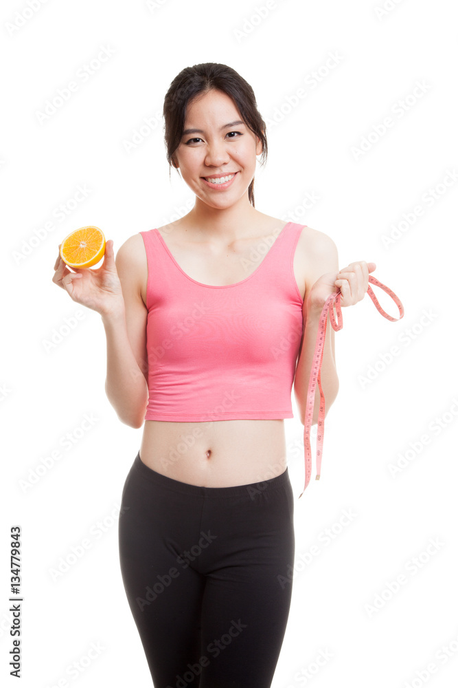 Asian healthy girl on diet with orange fruit and measuring tape. Asian healthy girl on diet with orange fruit and measuring tape.