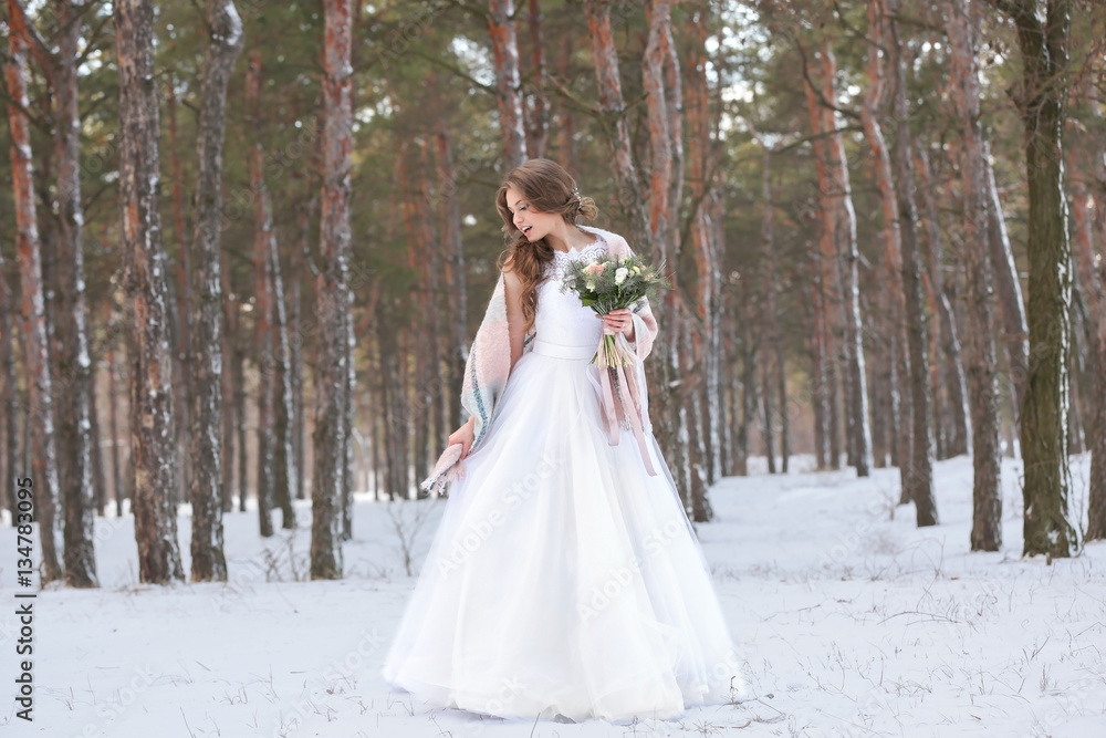 Beautiful bride with bouquet outdoors on winter day Beautiful bride with bouquet outdoors on winter day