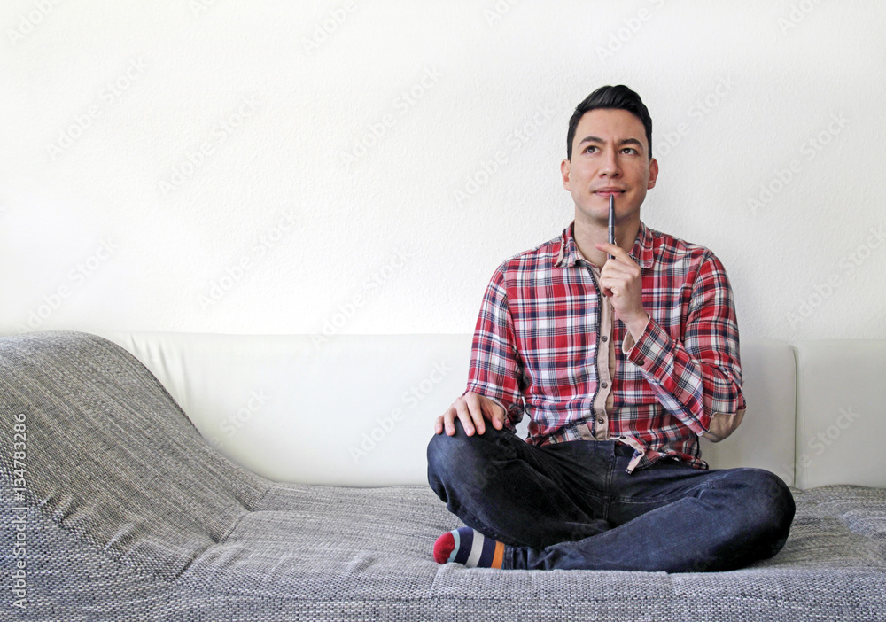 Man thinking on couch Man thinking on couch