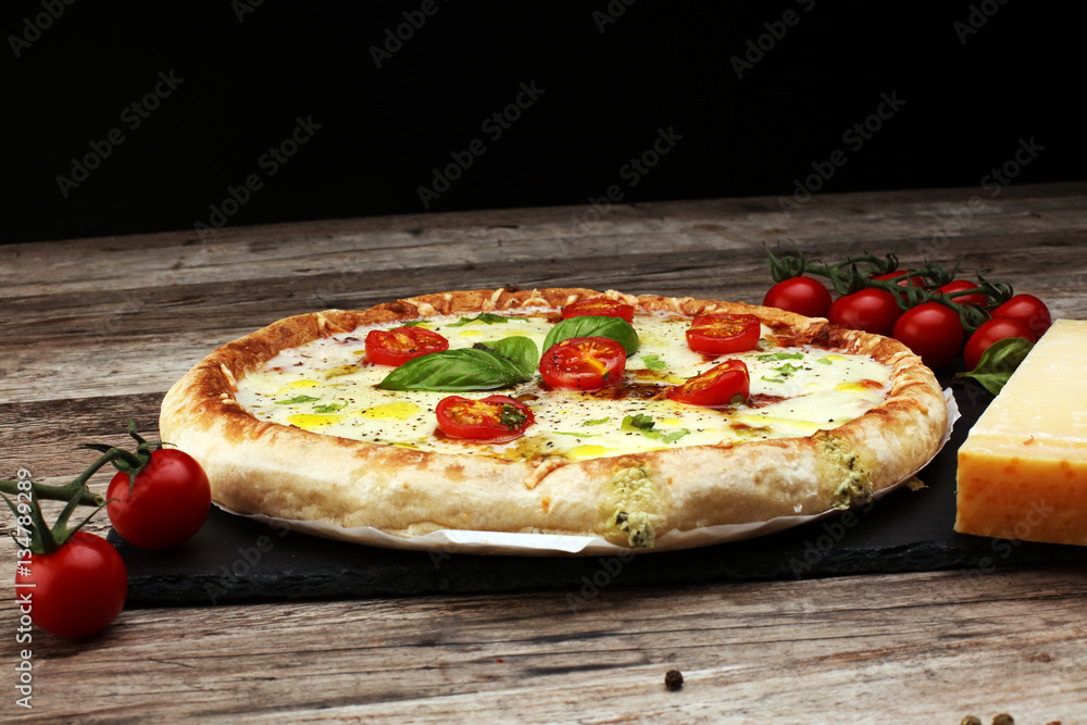 Hot true PEPPERONI ITALIAN PIZZA with salami and cheese. TOP VIEW Tasty traditional pepperoni pizza on board on wooden table with decoration Hot true PEPPERONI ITALIAN PIZZA with salami and cheese. TOP VIEW Tasty traditional pepperoni pizza on board on wooden table with decoration
