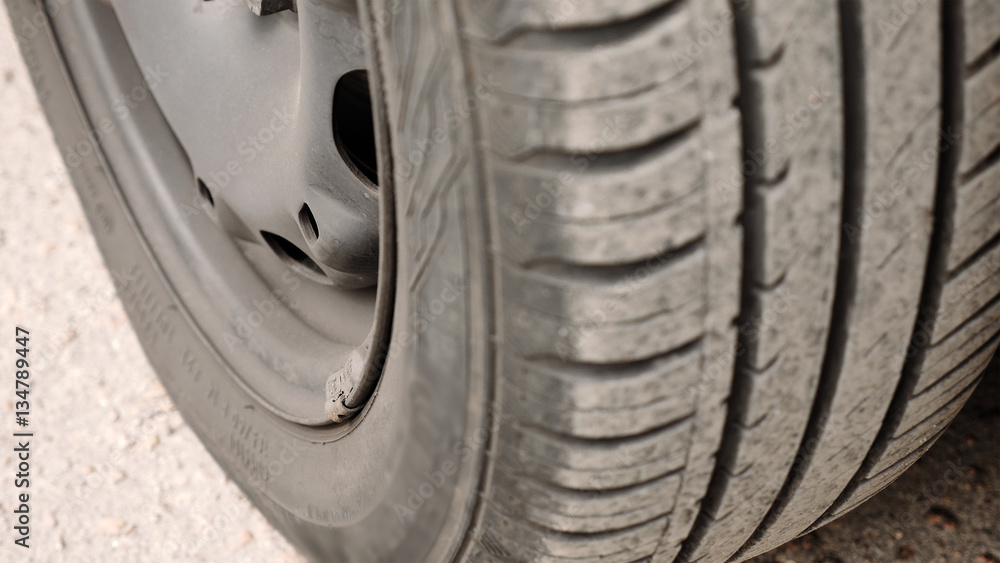Close-up of car wheel parts - tire, rim. Vehicle components concept. Detailed shot. Close-up of car wheel parts - tire, rim. Vehicle components concept. Detailed shot.