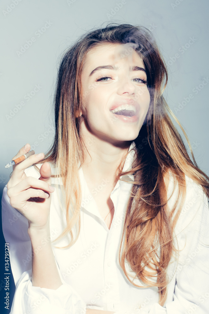 pretty sexy woman with long hair smoking cigarette in shirt pretty sexy woman with long hair smoking cigarette in shirt