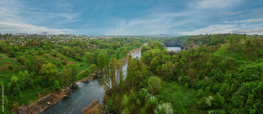 Panoramic view over a landscape of river and forest