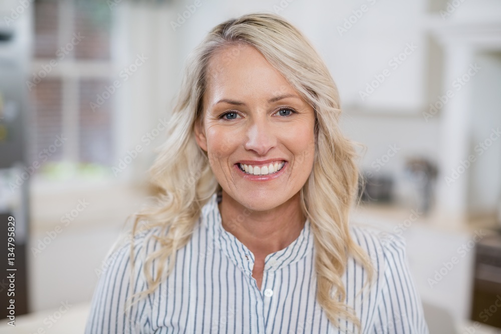 Fototapeta premium Beautiful woman smiling at home