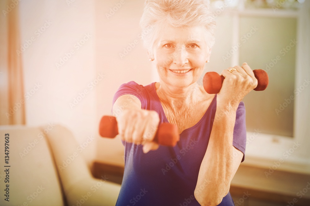 Woman exercising with dumbbells Woman exercising with dumbbells