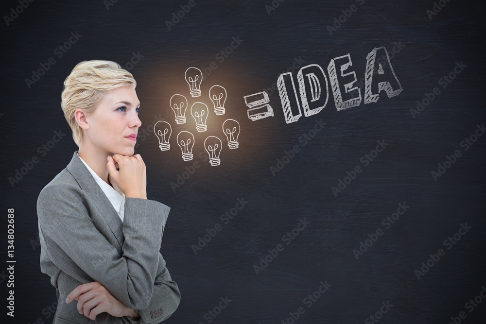 Composite image of businesswoman thinking with hand on chin