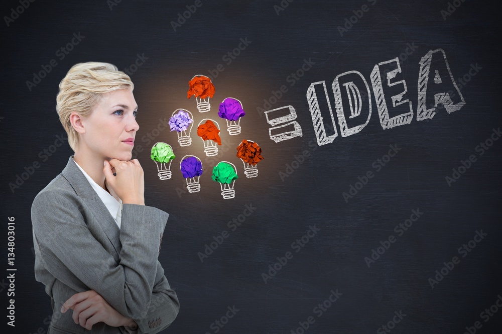 Composite image of businesswoman thinking with hand on chin Composite image of businesswoman thinking with hand on chin