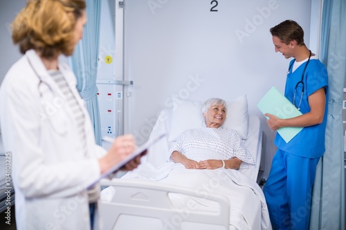 Doctors talking to a senior patient