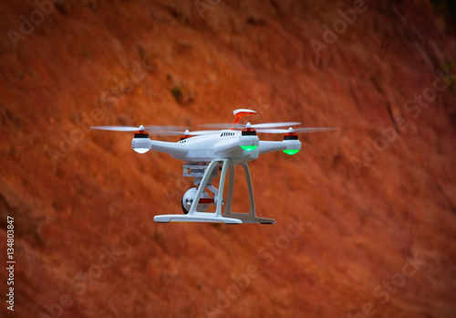 drone flying orange background