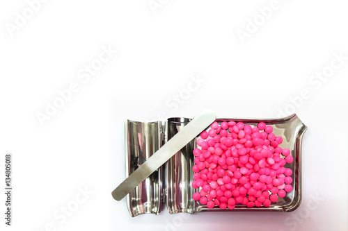 Pink Medicine Capsules on Stainless Steel drug tray, Isolated on