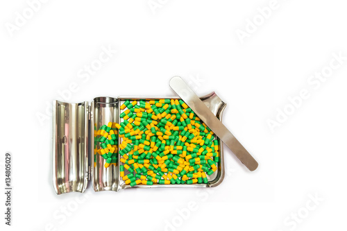 Two tone Medicine Capsules on Stainless Steel drug tray, Yellow