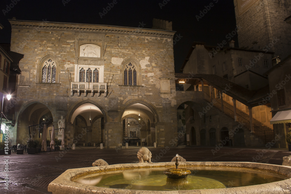 Bergamo - Old city (Citta Alta). One of the beautiful city in Italy. Lombardia. Landscape on the old main square (called Piazza Vecchia), the ancient Administration Headquarter and Contarini fountain.