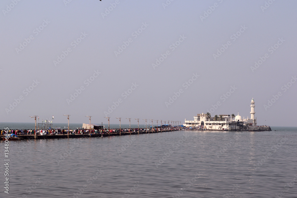 Unidentified pilgrims at Haji Ali Dargah, a historical landmark and one of the most prestigious Islamic symbols situated in South Mumbai.