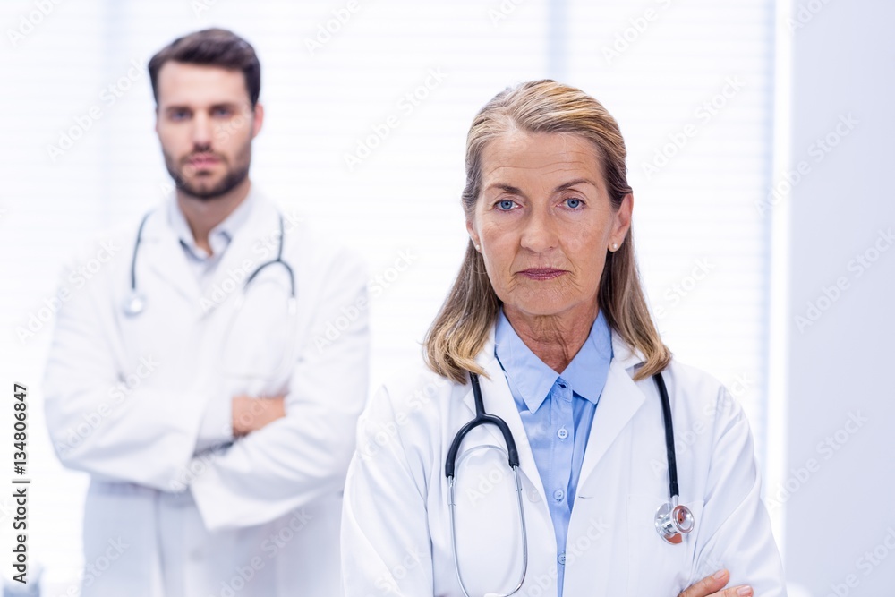 Portrait of doctors standing with arms crossed Portrait of doctors standing with arms crossed