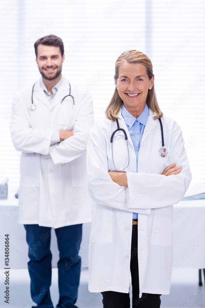 Portrait of doctors standing with arms crossed Portrait of doctors standing with arms crossed