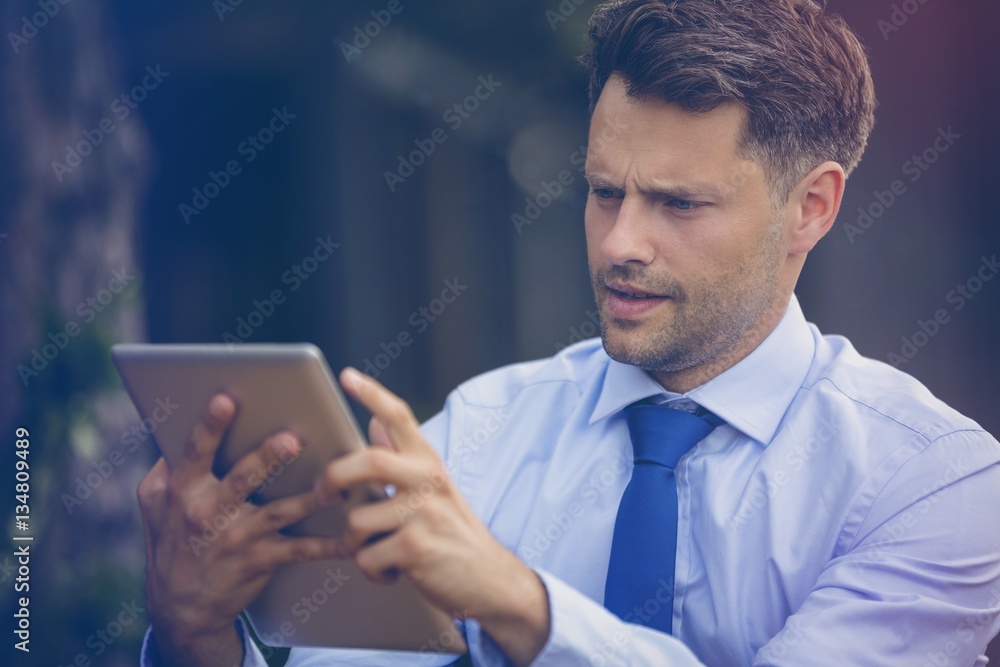 Close up of businessman using digital tablet Close up of businessman using digital tablet