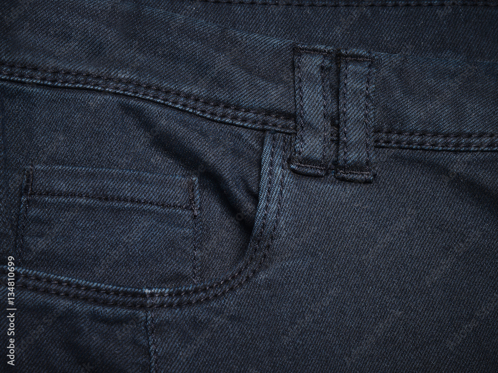 Navy blue denim textile for background closeup of pocket